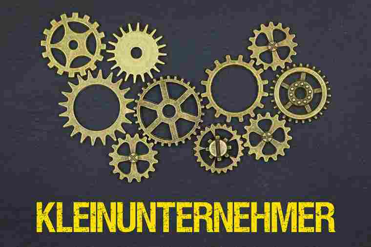 Zahnräder und Schriftzug Kleinunternehmer